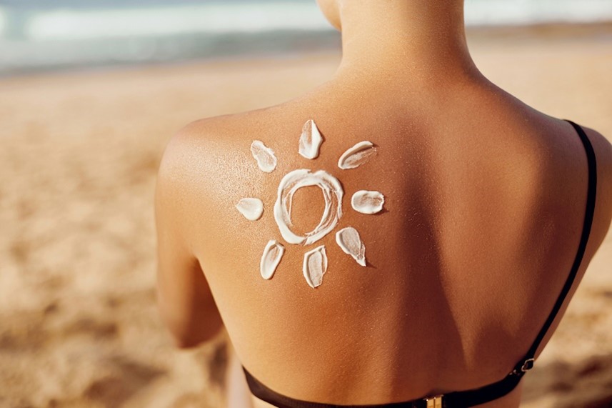 A person with sun cream on her back