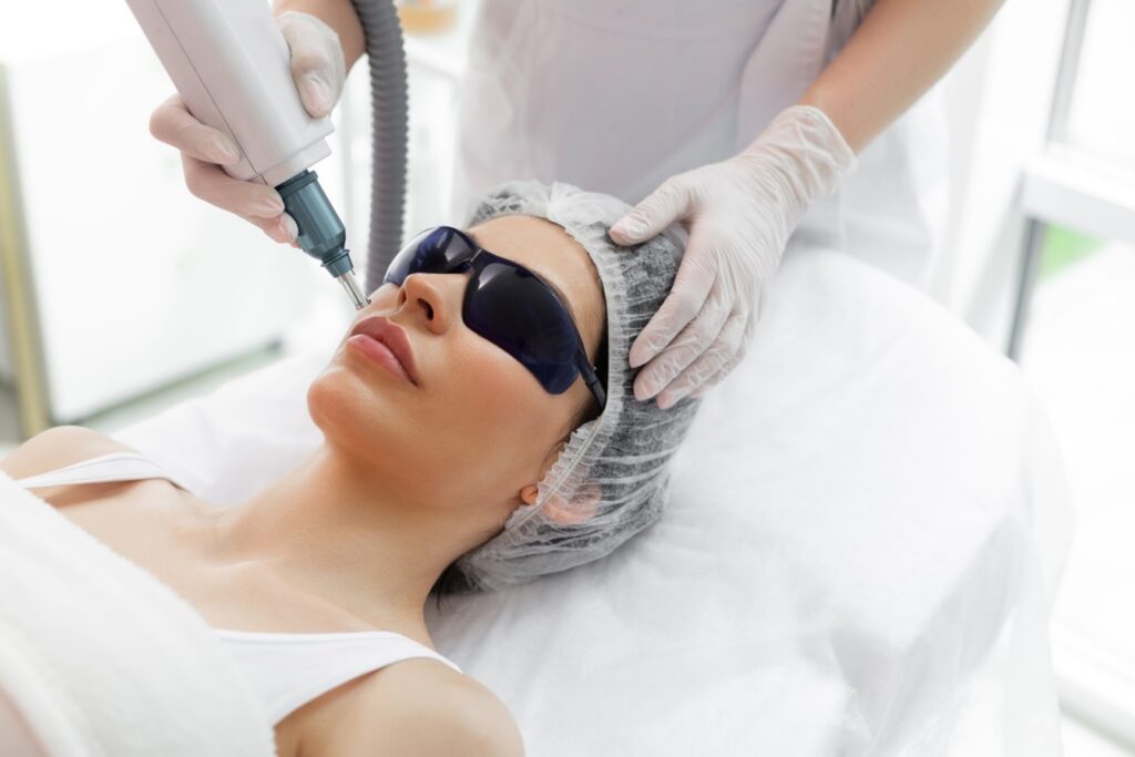 A person getting laser treatment on her face.